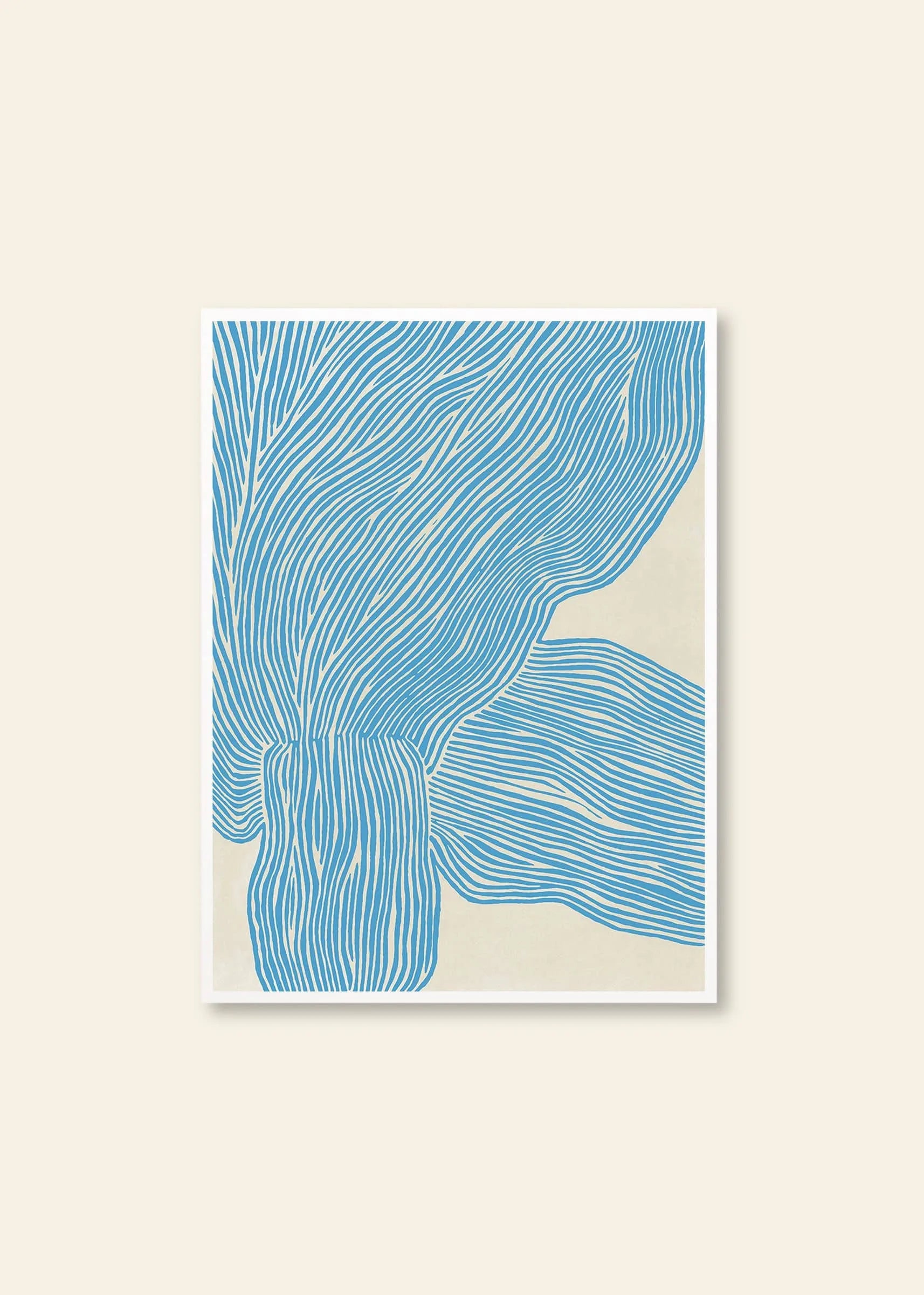 Rebecca Hein - The Line - Blue (30x40) by The Poster Club features flowing blue lines on a light beige background, evoking stylized leaves. This nordic-inspired, white-framed art print adds movement and texture to your space.