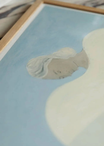 A close-up of The Poster Club Berit Mogensen Lopez - Bloom (50x70), featuring a person with light hair and pale skin on a blue background. This art print, showcased by The Poster Club, uses minimal details and soft, muted tones.