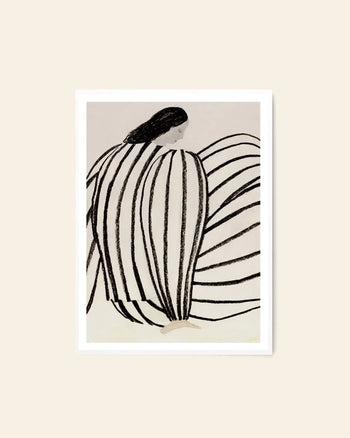 The Poster Club Sofia Lind - You (50x70) features a minimalist giclée print of a woman with long dark hair in a bold striped dress, set against an off-white background in a white frame, showcasing Sofia Lind’s signature elegant style.