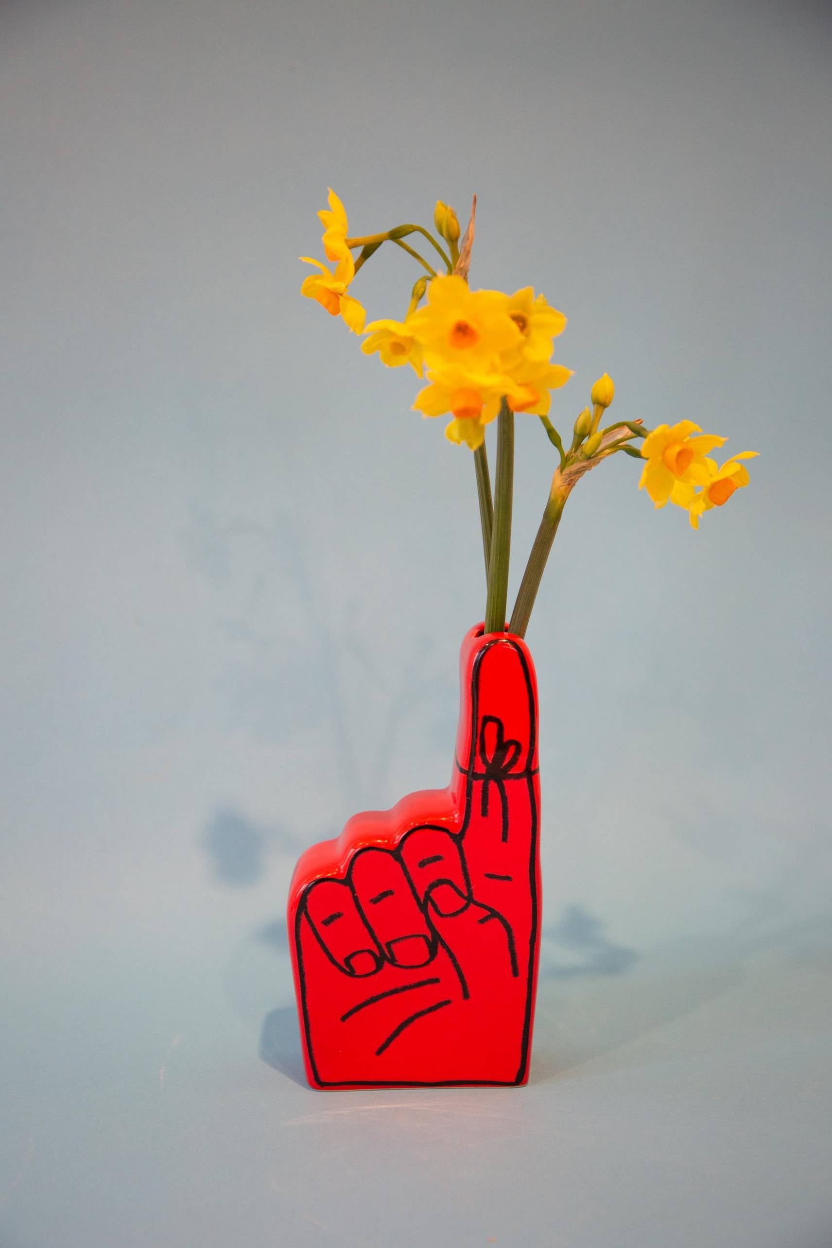 The Third Drawer Down Adam JK - Remember Bud Ceramic Vase, by Third Drawer Down, is a bright red hand-shaped ceramic vase—ideal for displaying flowers and celebrating memories in style.