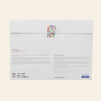The back of the Third Drawer Down David Shrigley - Fancy Room Tea Towel box features colorful text reading LARGE FANCY ROOM FILLED WITH CRAP and a handwritten note: ARE YOU SURE YOU WANT TO BUY THIS RUBBISH? A quirky, perfect gift.