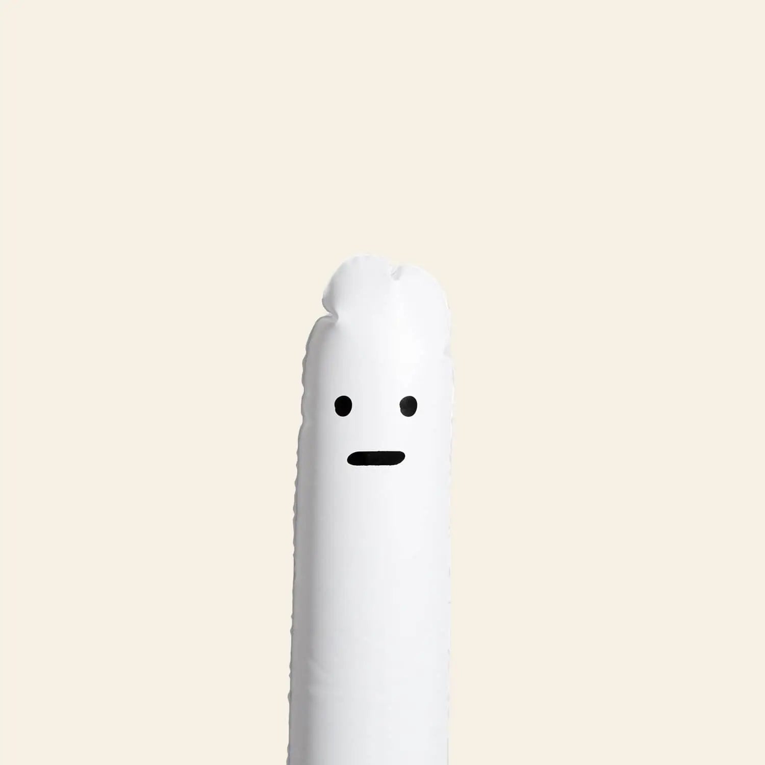 The Third Drawer Down David Shrigley Ridiculous Inflatable Swan-Thing, a white tube with cartoon features, stands upright against a beige background.