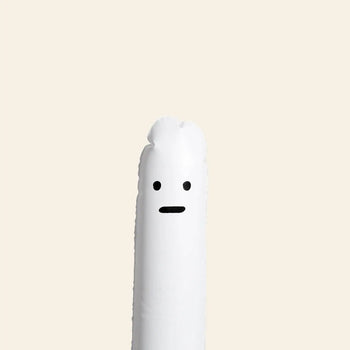The Third Drawer Down David Shrigley Ridiculous Inflatable Swan-Thing, a white tube with cartoon features, stands upright against a beige background.