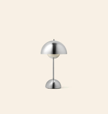The &Tradition Flowerpot VP9 Portable Table Lamp features a modern silver dome shade and base on a slim rod, set against a light beige background. Includes USB charging cable for convenience. Brand: &Tradition.