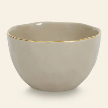 The Urban Nature Culture Good Morning Bowl features a beige ceramic design with a wavy rim and thin gold edge, combining elegance and simplicity—ideal for breakfast—set against a plain light background.
