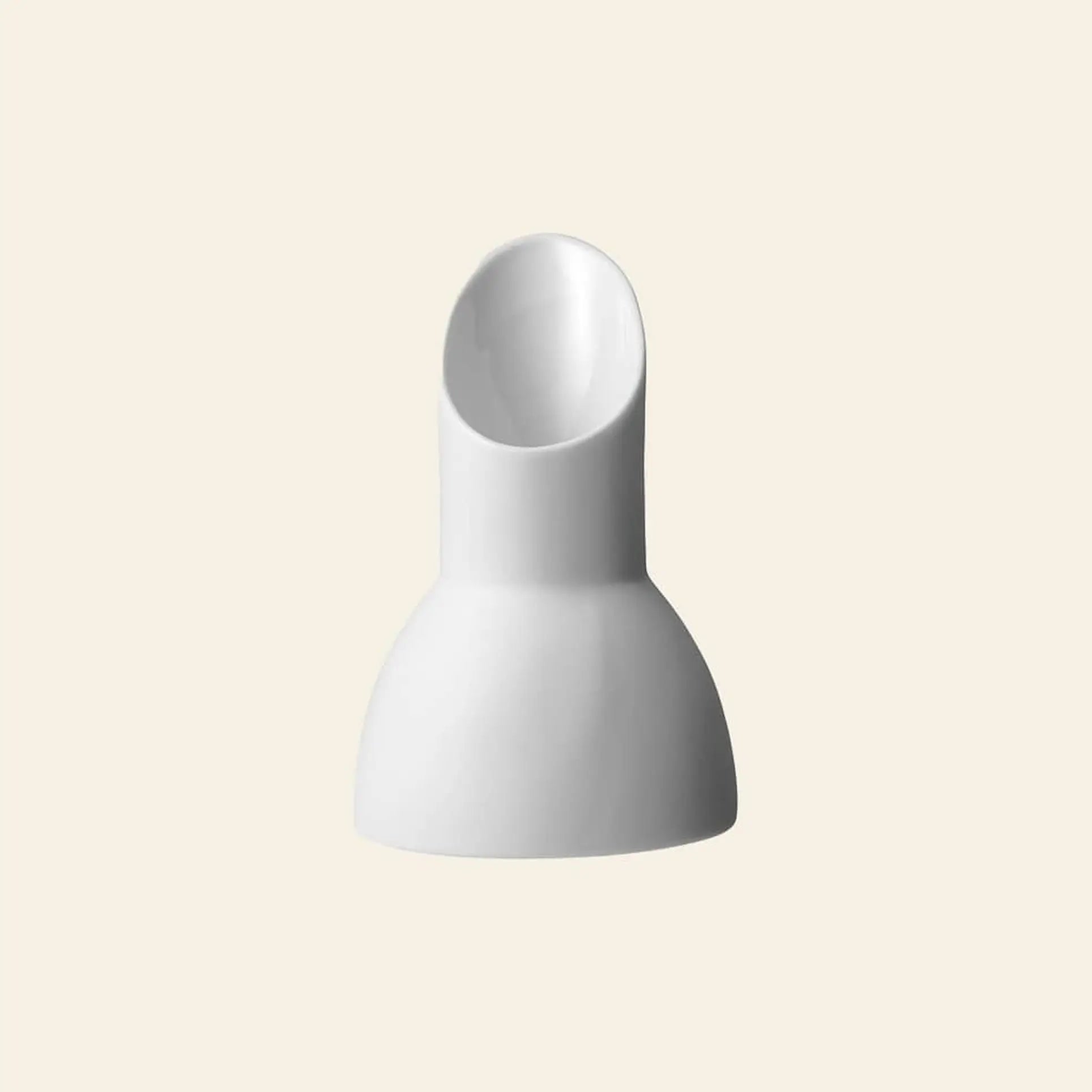 The Vipp Vipp205 Milk Jug by Vipp is a white, modern ceramic vase with a rounded base and tilted spout, featured against a plain beige background.