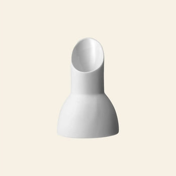 The Vipp Vipp205 Milk Jug by Vipp is a white, modern ceramic vase with a rounded base and tilted spout, featured against a plain beige background.