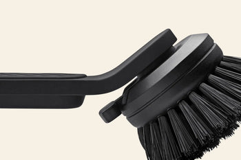 Close-up of the Vipp Vipp280 Dishwashing Brush by Vipp, showcasing its dense bristles, ergonomic handle, and replaceable brush head against a plain background—perfect for efficient kitchen cleaning.