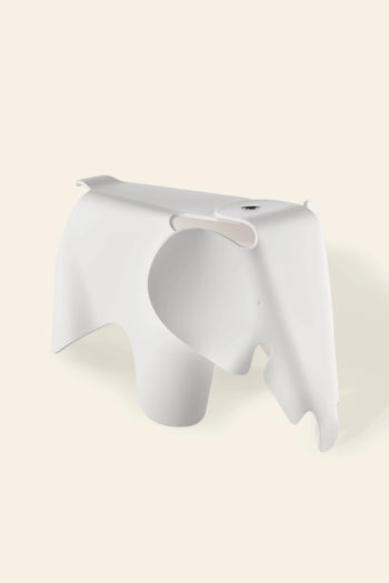 The Vitra Eames Elephant, Small by Vitra features smooth curves, a stylized trunk and ears, and a minimalist white design—making it an iconic decorative accent for any space.
