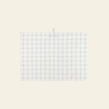 The WARMGREY TAIL Dot Check Kitchen Cloth 2 features a white base with light blue and grey plaid, hanging by a small top loop against a beige background—an elegant, versatile kitchen accessory from WARMGREY TAIL for any home.