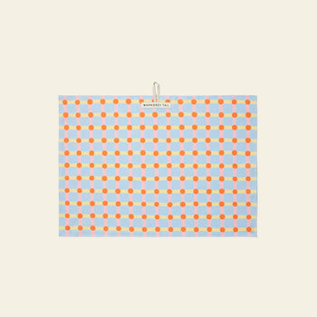 The WARMGREY TAIL Dot Check Kitchen Cloth 2 is a rectangular tea towel with orange and red dots connected by blue lines on a light background, featuring a handy top-center loop and label for easy hanging.