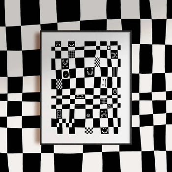 The Wobbly Studio Checkmate (30x40) by Wobbly Studio is a framed digital print with wavy black-and-white checks and face doodles, displayed against a matching distorted checkered wall.