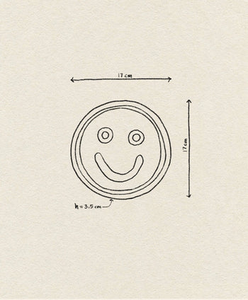The Wobbly Studio Mood Tray by Wobbly Studio features a hand-drawn smiley face (17 cm diameter, 3.5 cm height) on off-white textured paper—perfect for a personalized display.