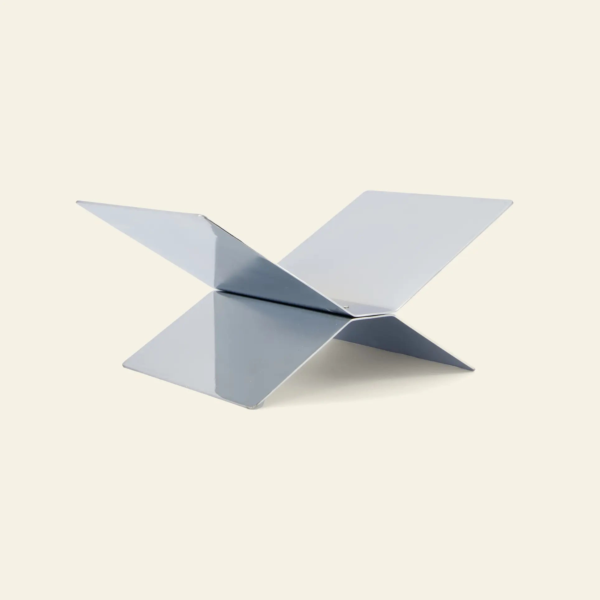 The baebsy Atlas Bookstand by baebsy features two intersecting flat panels in an X shape for a modern, minimalist levitation look, shown against a neutral background.