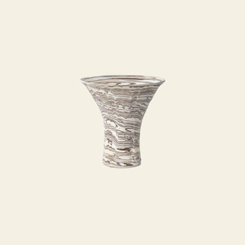 The ferm LIVING Blend Vase, Large by ferm LIVING is a wide, flared handcrafted vase with a narrow base, showcasing earthy brown and white marbled swirls, set against a simple light background.