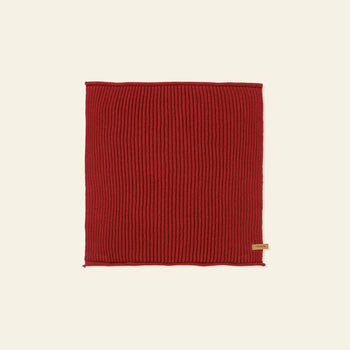A set of seven rectangular, ribbed, red organic cotton Day Cloths by ferm LIVING, each featuring a small beige tag on one edge, is laid flat on a plain light background.