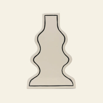 A flat, white ceramic tray by ferm LIVING, featuring a curvy, stylized outline of the Paste Vase in bold black, shown on a plain beige background.