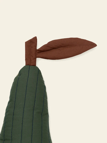 The ferm LIVING Pear Quilted Cushion, crafted from organic quilted cotton with blue stitching and a brown stem and leaf, resembles a stylized pear in soft green tones.