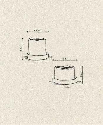 A simple line drawing shows two ferm LIVING Uneru Mini Pots—cylindrical stoneware pots with uneven tops, each labeled with their size: 5.4 x 5.5 cm and 6.3 x 4.2 cm—perfect as a unique plant gift.