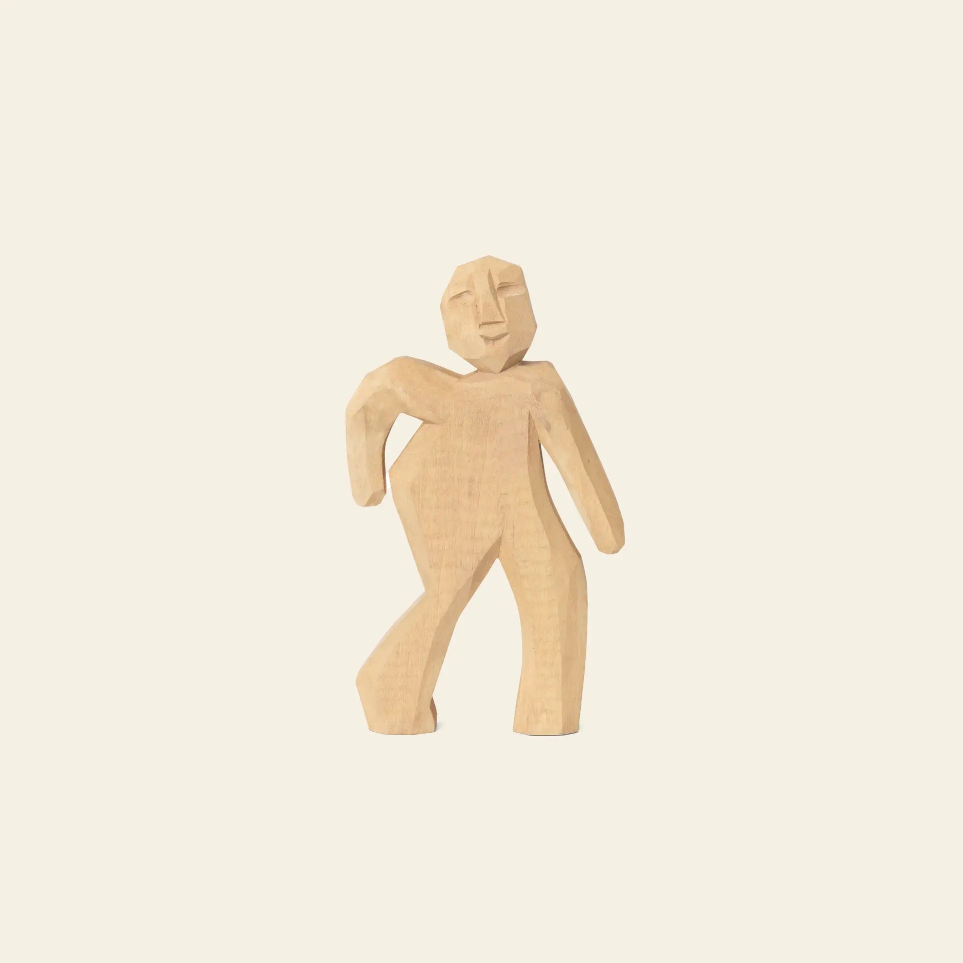 The ferm LIVING Victor Hand-Carved Figure by ferm LIVING features a geometric, abstract human form with one bent arm, crafted from wood—ideal for imaginative play, displayed against a light background.