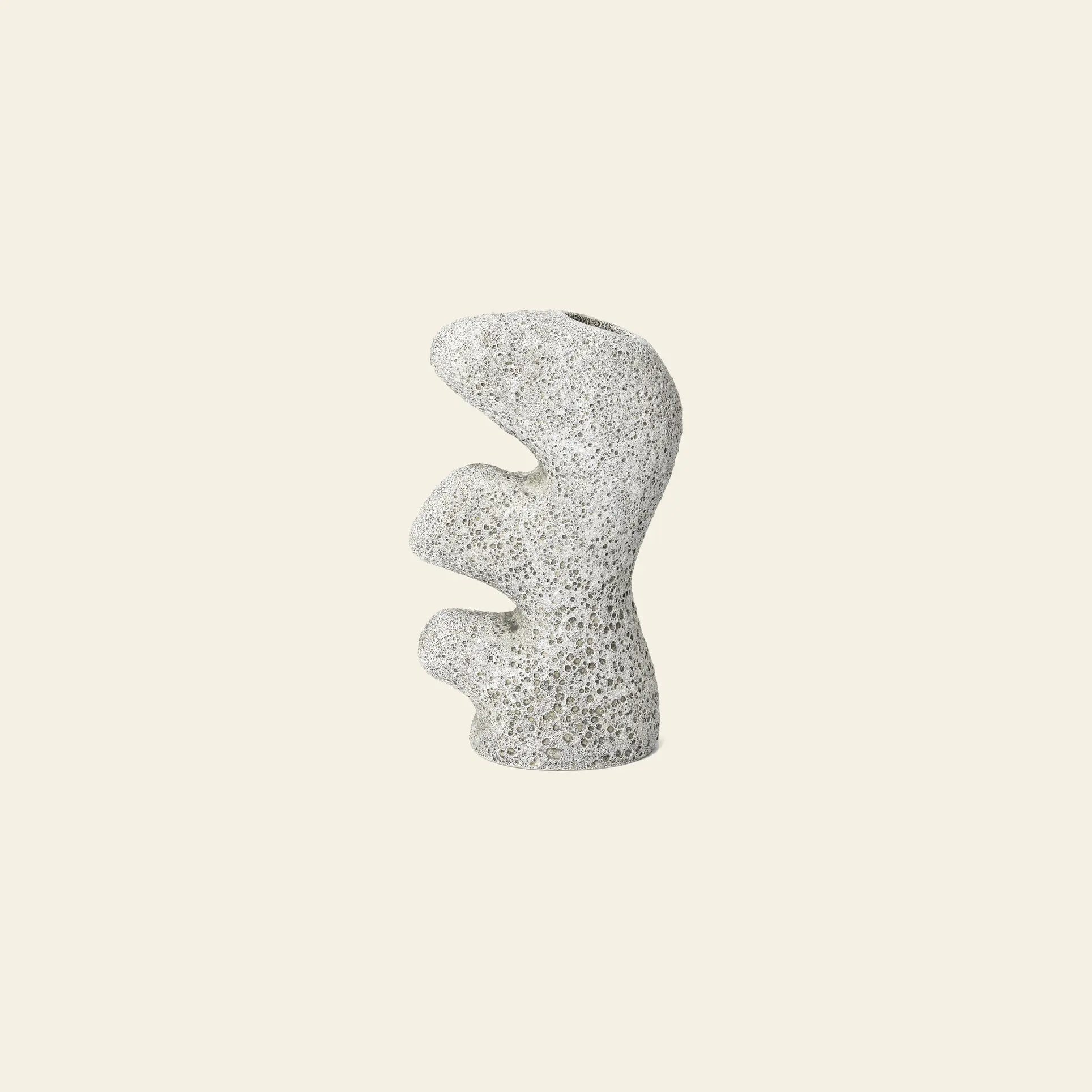 The ferm LIVING Yara Vase, Small features a sculptural, abstract design with organic wavy curves and a speckled light gray surface, from the ferm LIVING collection, shown against a plain beige background.