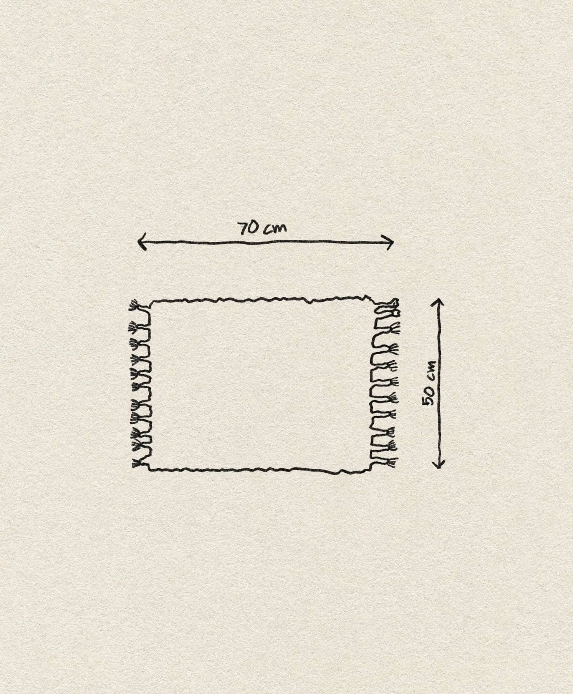 A hand-drawn sketch of the ferm LIVING Amass Long Pile Mat, a rectangular rug with fringe on both sides, measures 70 cm wide by 50 cm tall, shown with labeled double-headed arrows on an off-white background.