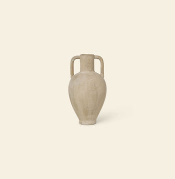 The ferm LIVING Ary Mini Vase L, a beige stoneware vase with two handles and a subtle textured glaze inspired by ancient Greek vases, sits centered against an off-white background.