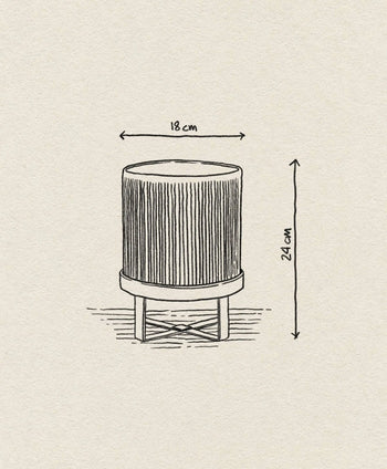 A hand-drawn illustration depicts the ferm LIVING Bau Pot, Small—a modern cylindrical pot with vertical lines and short legs—highlighting its 18 cm diameter and 22 cm height. Inspired by Bauhaus architecture, its designed by ferm LIVING.