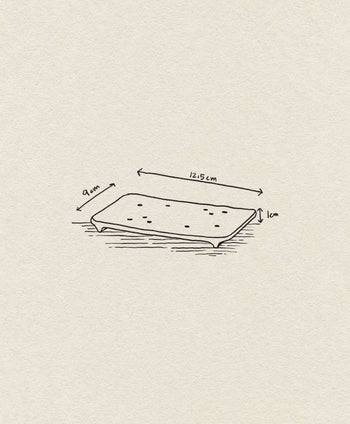 The ferm LIVING Bon Accessories Soap Tray, by ferm LIVING, is a hand-drawn rectangular tray with small dots, measuring 12.5 cm x 9 cm x 1 cm, shown with measurement arrows on a textured paper background.
