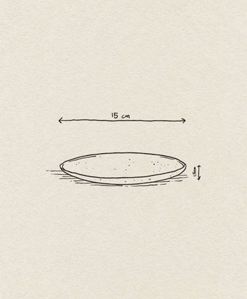 A simple side-view line drawing of the ferm LIVING Flow Plate, Small (15 cm wide, 1.5 cm tall), with labeled dimensions on a light textured paper background.