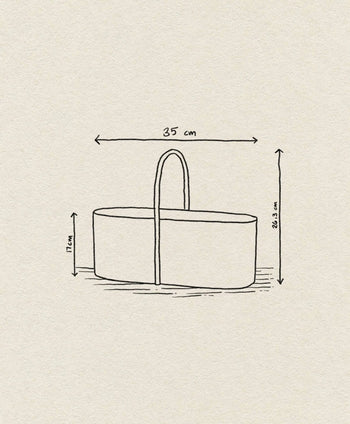 A simple line drawing of the ferm LIVING Grib Toolbox, a slim oval basket with handle, perfect as a stationery organizer; measuring 35 cm long, 17 cm high at the side, and 36.3 cm high including handle. Off-white background highlights its design.