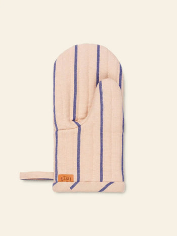 The ferm LIVING Hale Oven Mitt by ferm LIVING is a heat-resistant beige mitt featuring vertical blue stripes and a small brown tag near the cuff, displayed against a plain light background.