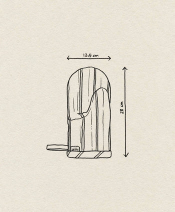 A hand-drawn side view of the ferm LIVING Hale Oven Mitt, curvy and vertical with a flat base. Height: 28 cm, width: 13.5 cm. Sketch on textured off-white paper and labeled ferm LIVING.