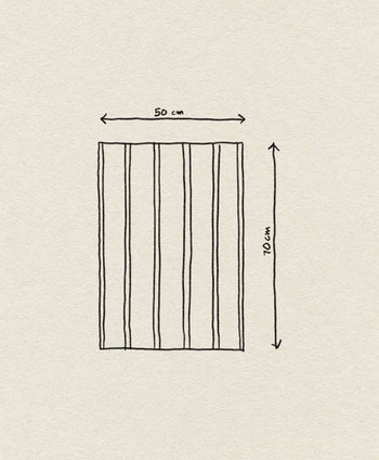 A hand-drawn rectangle divided into six vertical sections, labeled with arrows showing 50 cm width and 70 cm height, appears on a textured background, illustrating the size of the ferm LIVING Hale Tea Towel by ferm LIVING.