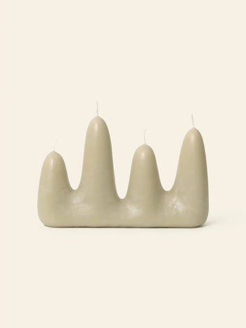 The ferm LIVING Stala Candle features four beige, rounded peaks of varying heights, each with its own wick, offering unique decor by ferm LIVING and photographed against a plain light background.