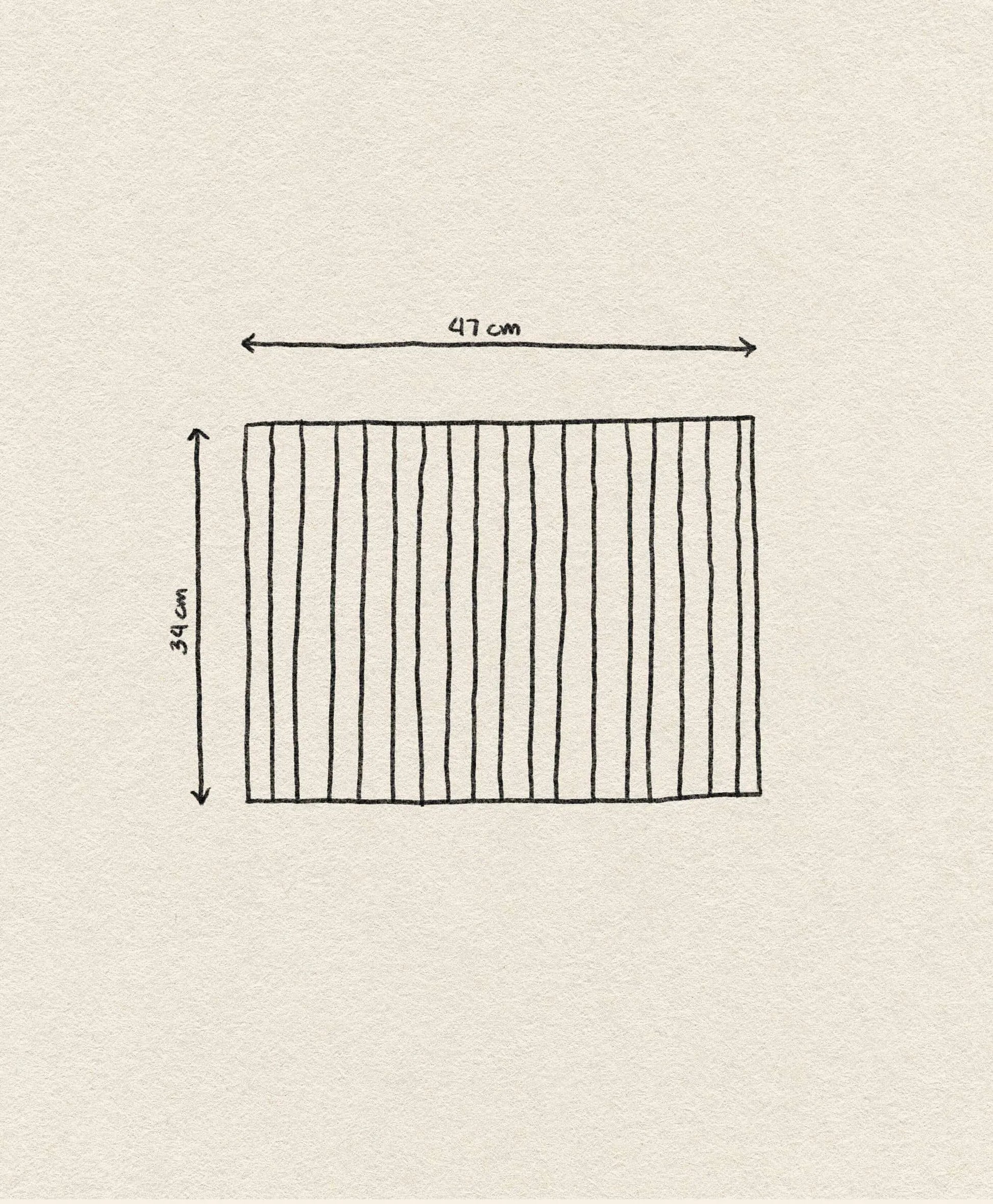 A hand-drawn rectangle with vertical lines, inspired by the &klevering Bay Placemat (set of 6), 47 cm wide and 34 cm tall, shown on a textured beige background with labeled arrows displaying its dimensions.