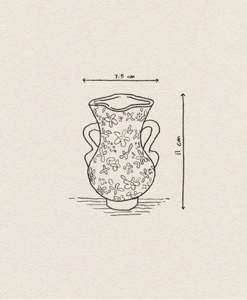 Line drawing of the &klevering Bloom Vase by &klevering, featuring two handles and petite flowers for a romantic touch. Labeled arrows show its 7.5 cm width and 11 cm height on a textured beige background.