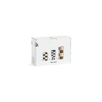 A white &klevering box shows images of three Carré Vases in various colors and geometric shapes, with “Vase core” printed below. Set of 3 by &klevering.