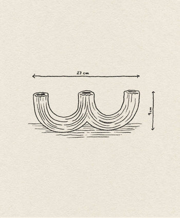 A simple line drawing of the &klevering Churros Candle Holder Light Blue, 27 cm wide and 9 cm tall, appears on a textured beige background. Arrows indicate its dimensions, highlighting this unique &klevering home decor piece.