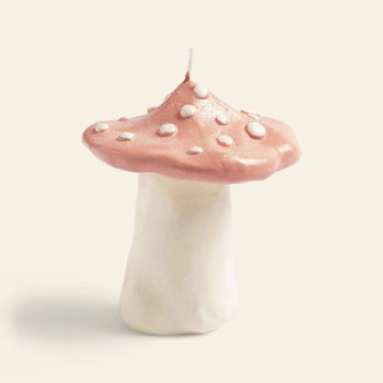 Illuminate your space with the &klevering Dots Mushroom Candle, featuring a whimsical design with a thick white stem and rounded pink cap dotted in white—perfect for adding enchanting ambiance to any plain light background.