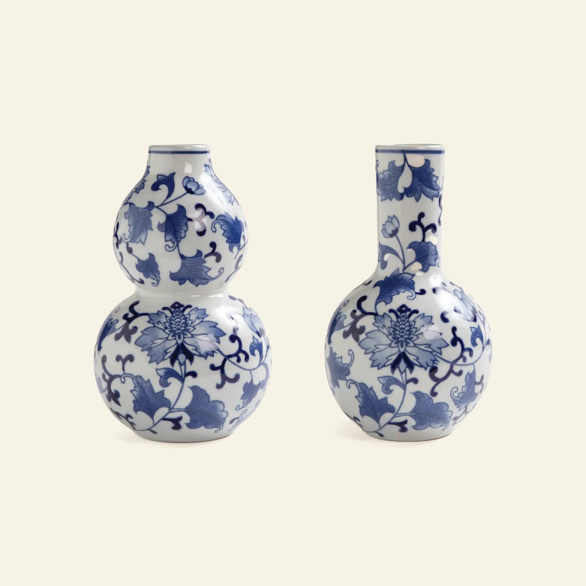 The &klevering Dutch Delight Vase Large Set of 2 features white porcelain vases with blue floral patterns, including double-gourd and tall-neck shapes, inspired by classic Delftware designs.