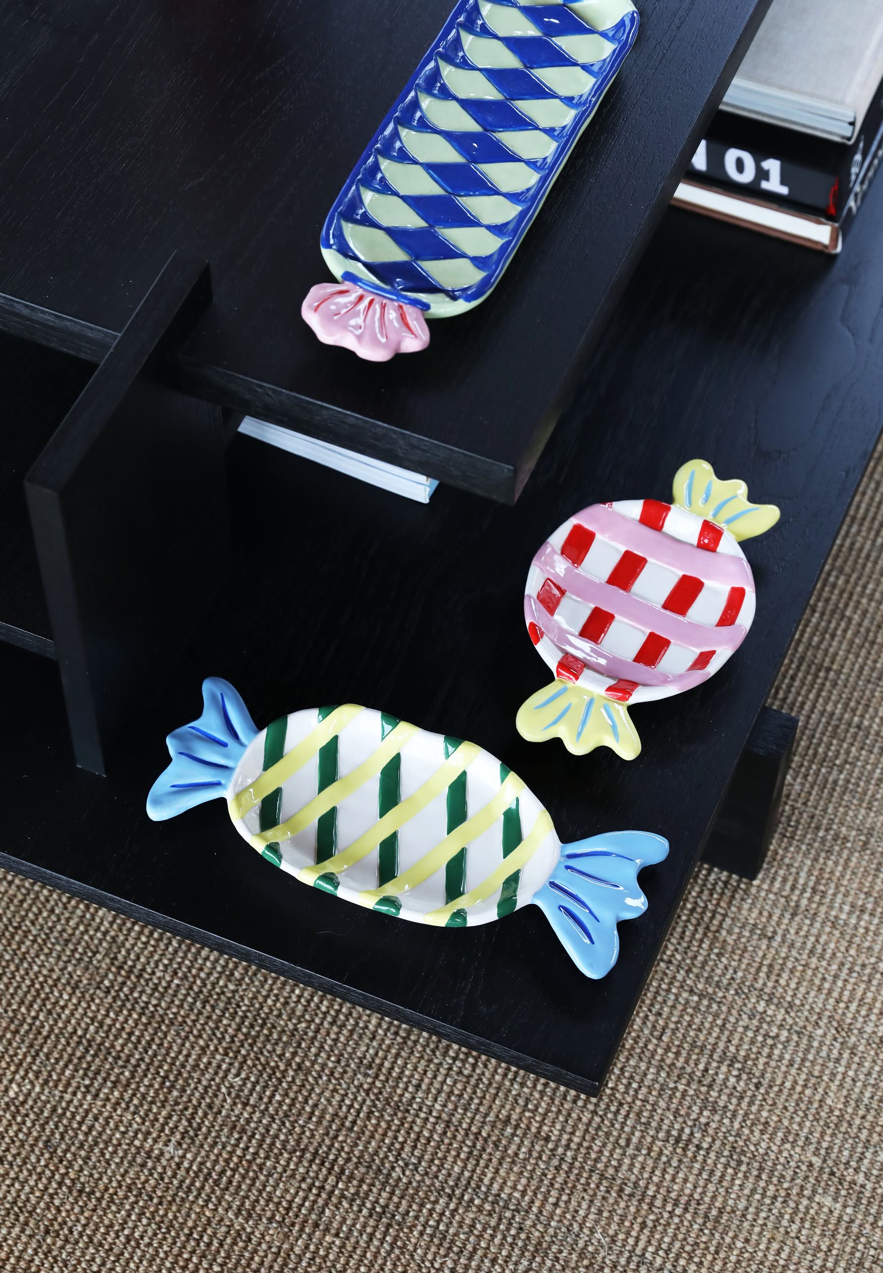 The &klevering Goody Plate, Medium by &klevering features a whimsical candy-inspired design with checkered patterns in blue, green, red, and yellow—perfect for brightening up any dining setting.