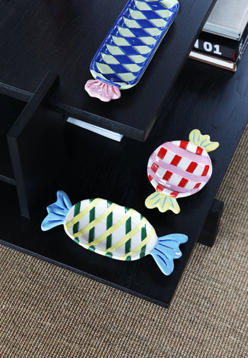 The &klevering Goody Plate, Medium by &klevering features a whimsical candy-inspired design with checkered patterns in blue, green, red, and yellow—perfect for brightening up any dining setting.