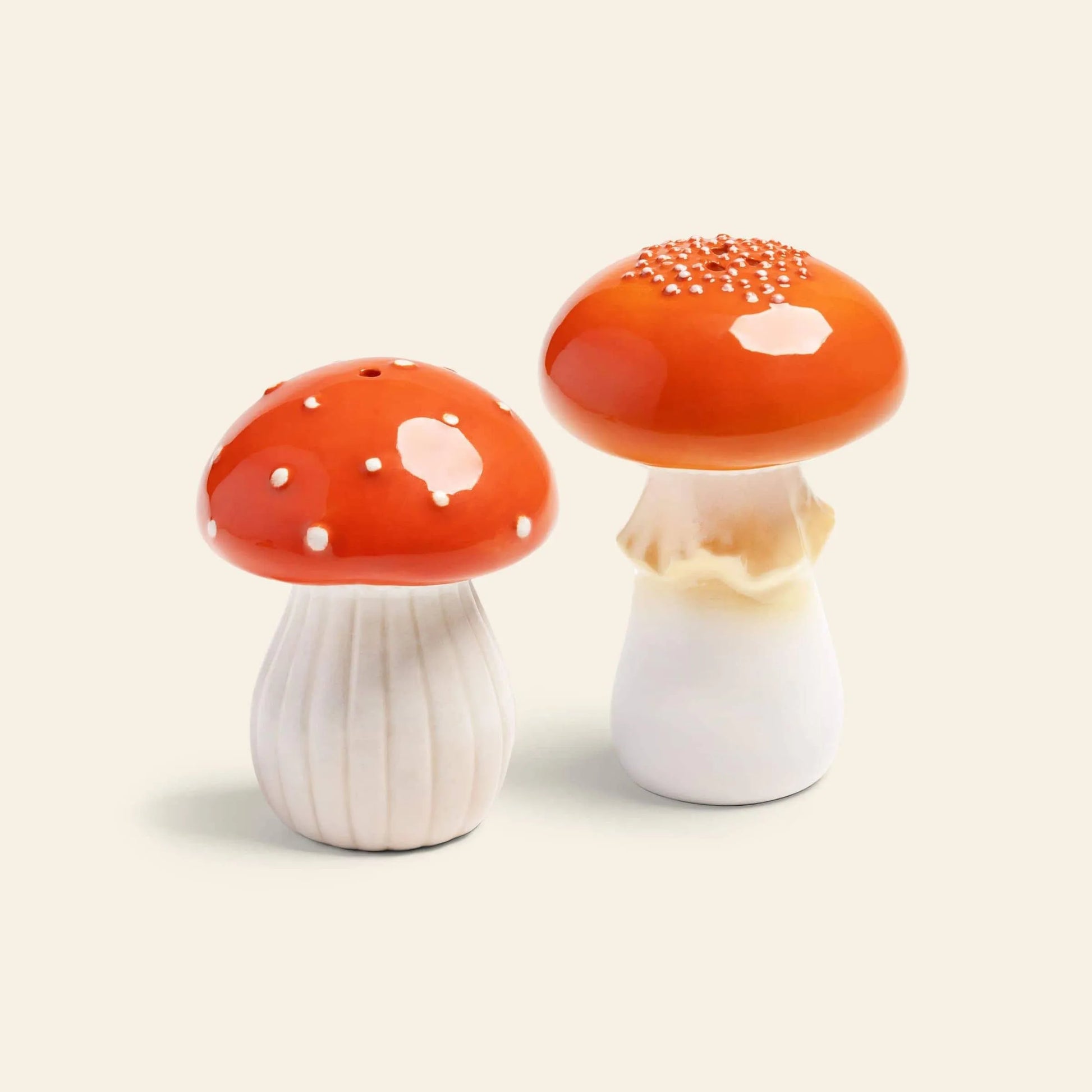 The &klevering Mushroom Salt & Pepper Set by &klevering features ceramic shakers shaped like red and white mushrooms—ideal for adding a whimsical touch to your kitchen decor.