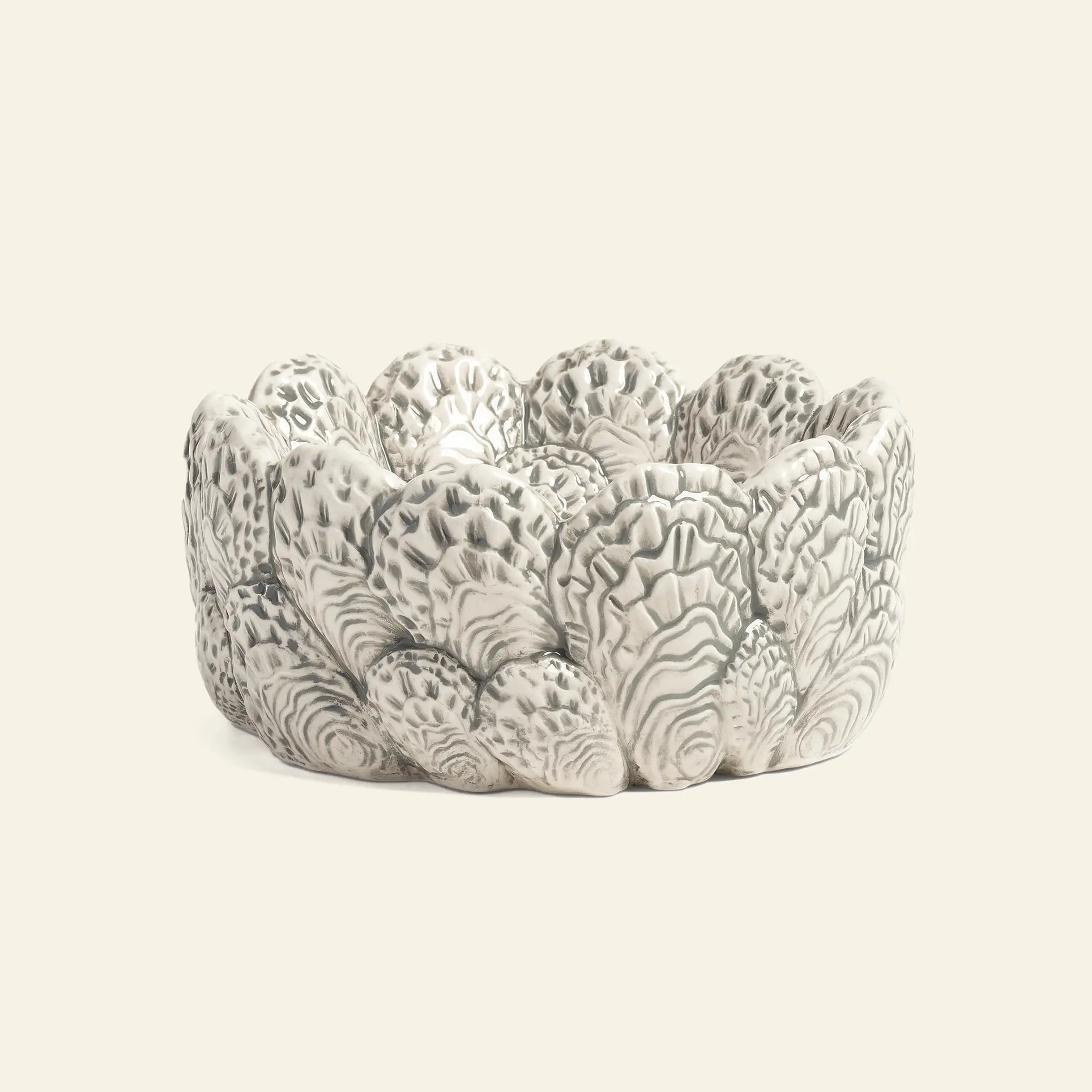 The &klevering Oyster Bowl by &klevering features a textured, scalloped design in white and gray, resembling oyster shells—ideal for oyster lovers or serving appetizers. Shown on a plain light background.