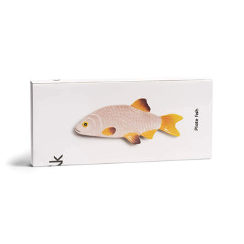 A rectangular white box displays the &klevering Snapper Fish Plate with yellow fins and tail—ideal as a dining table centrepiece. “Plate fish” is printed on the side.