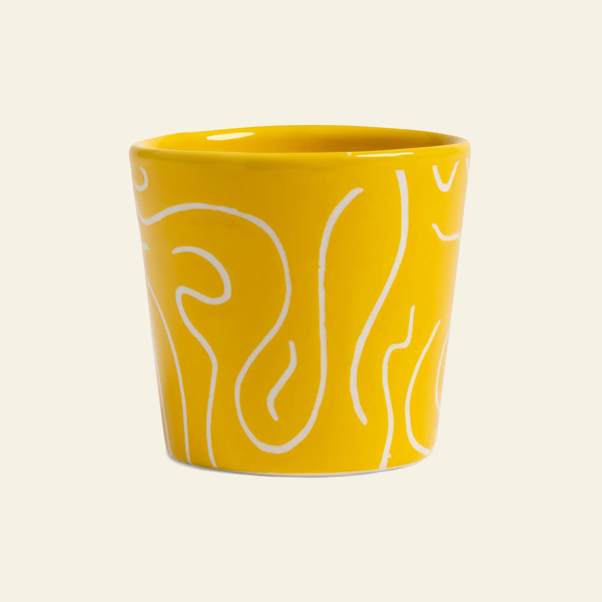 The &klevering Soba Mug Small, Set of 4, features yellow ceramic mugs with a glossy finish and white abstract line patterns inspired by traditional soba mugs.