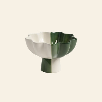 The &klevering Sun Bowl by &klevering features a ceramic design with scalloped edges, white and green sections, and a short pedestal base—creating a modern, eye-catching accent for any space.