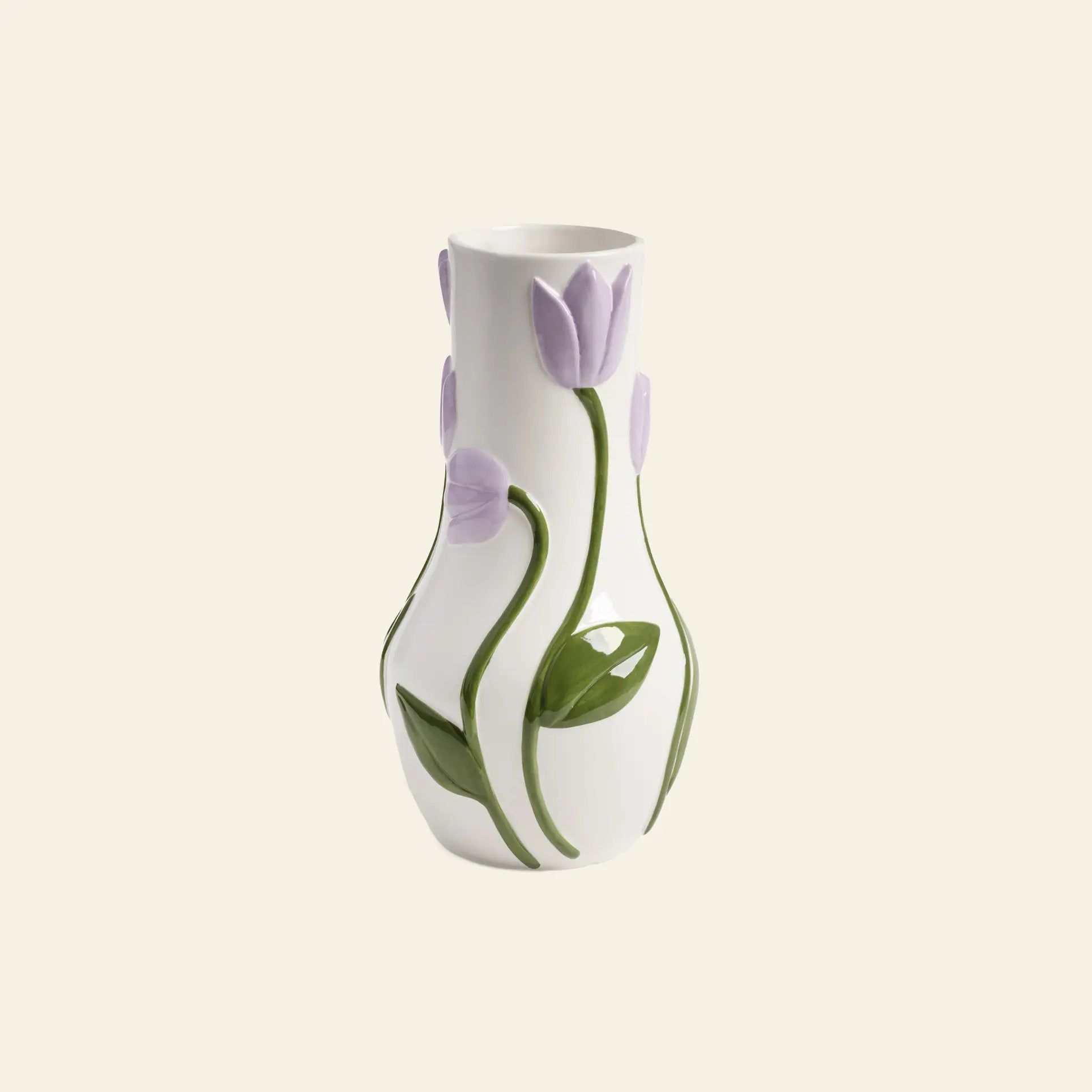 The &klevering Tulip Vase, Large, by &klevering, in white ceramic with embossed lavender tulip motifs and green leaves, makes a charming decorative accent against a plain light background.