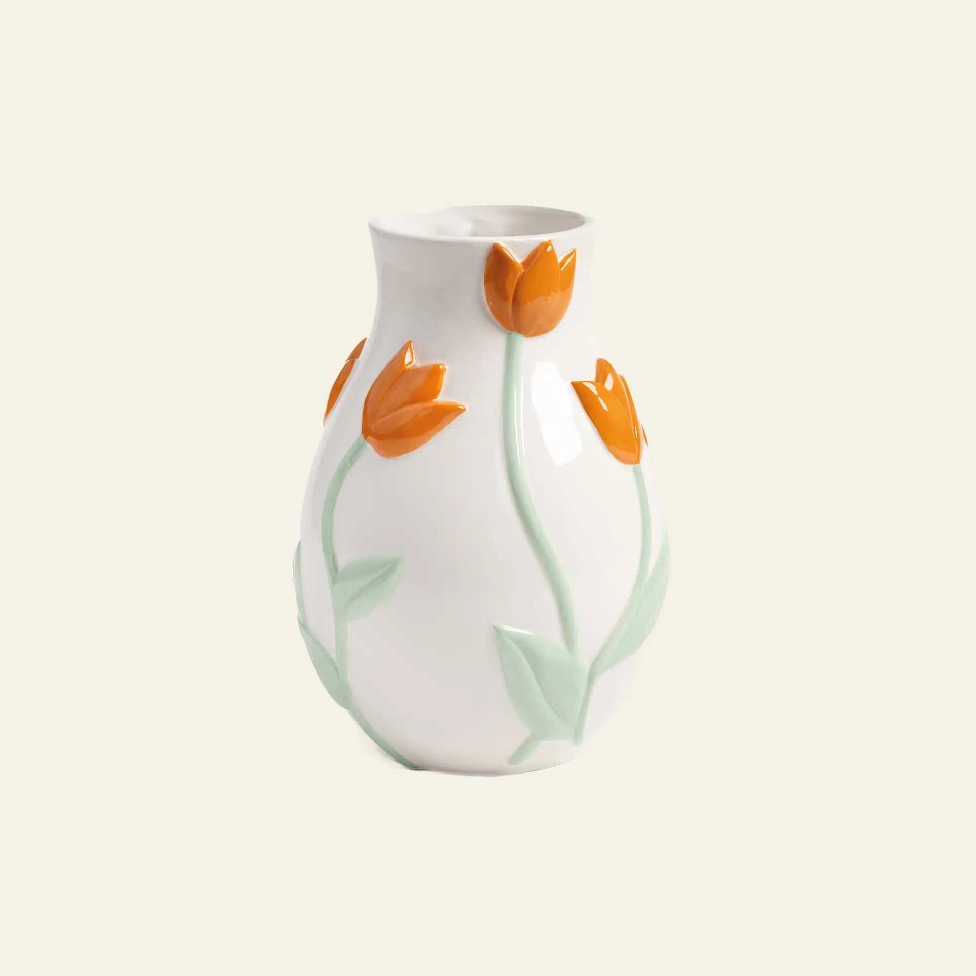 The &klevering Tulip Vase, Small, by &klevering, is a white ceramic piece featuring raised orange tulip motifs with green stems and leaves, inspired by the Netherlands and set against a light beige background.